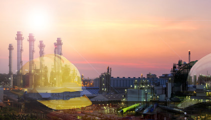 Spherical product storage vessels within a petroleum terminal at sunset